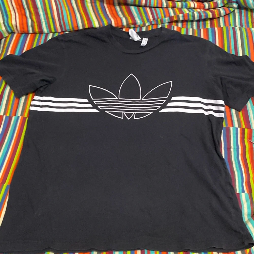 Adidas graphic logo T-shirt, size medium, black, and white wraparound print